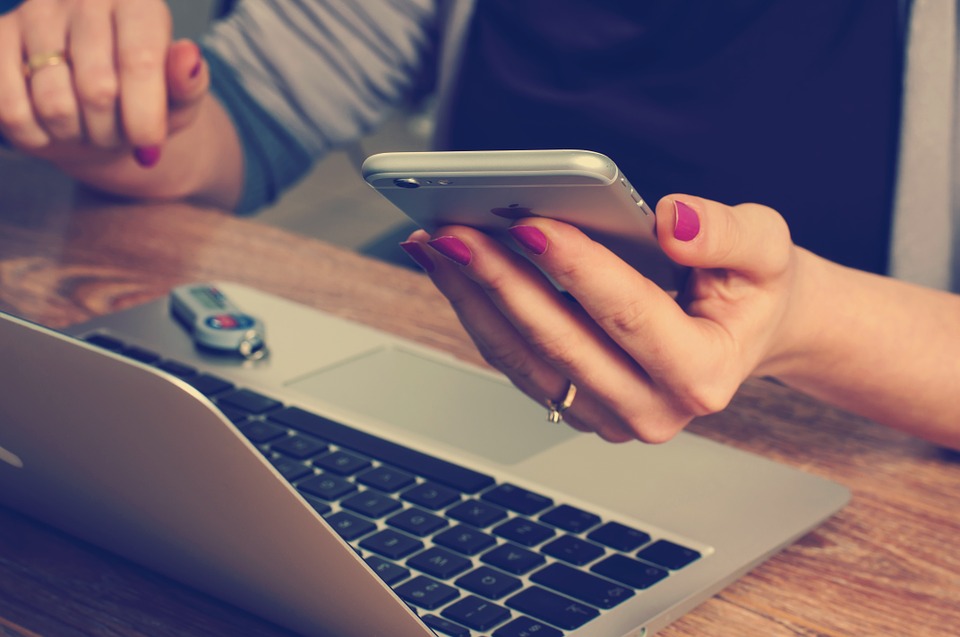 using an iPhone and a laptop