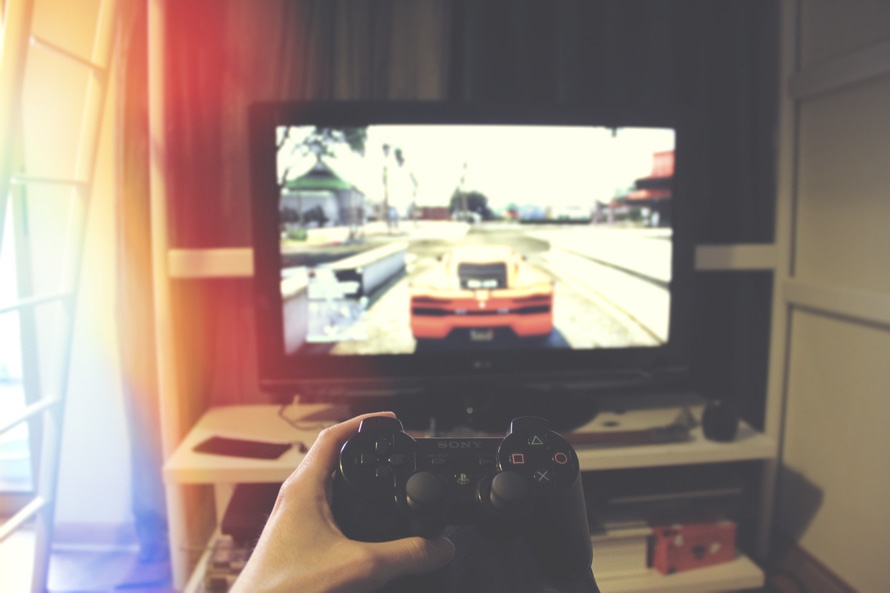 Playing PlayStation gaming console